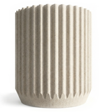 Textured vase with ribbed design on a white background